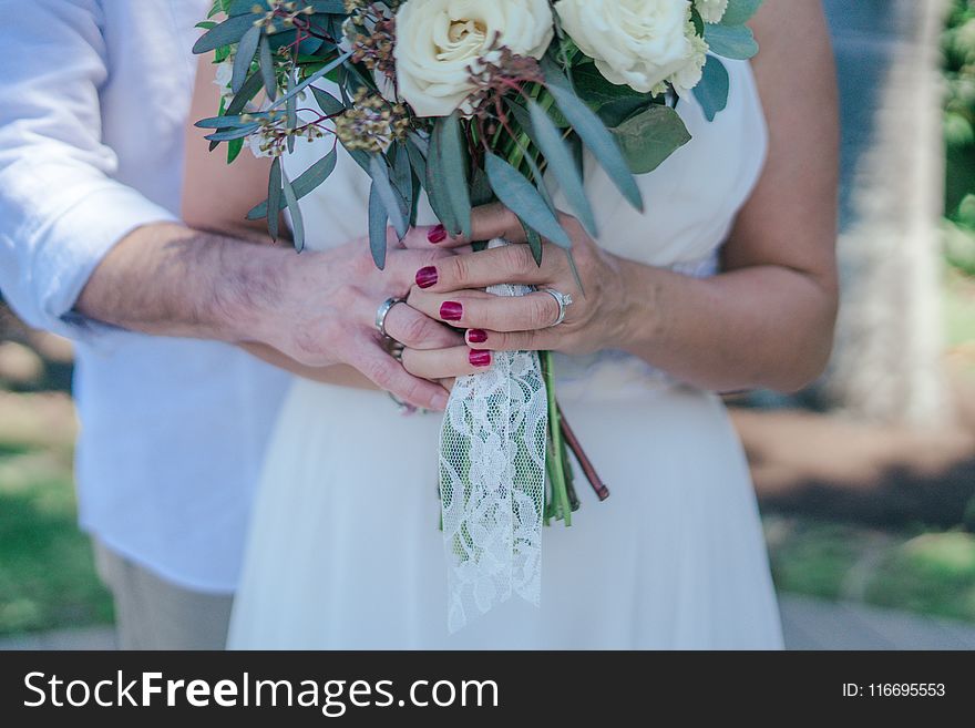 Woman Holding White Bouquet