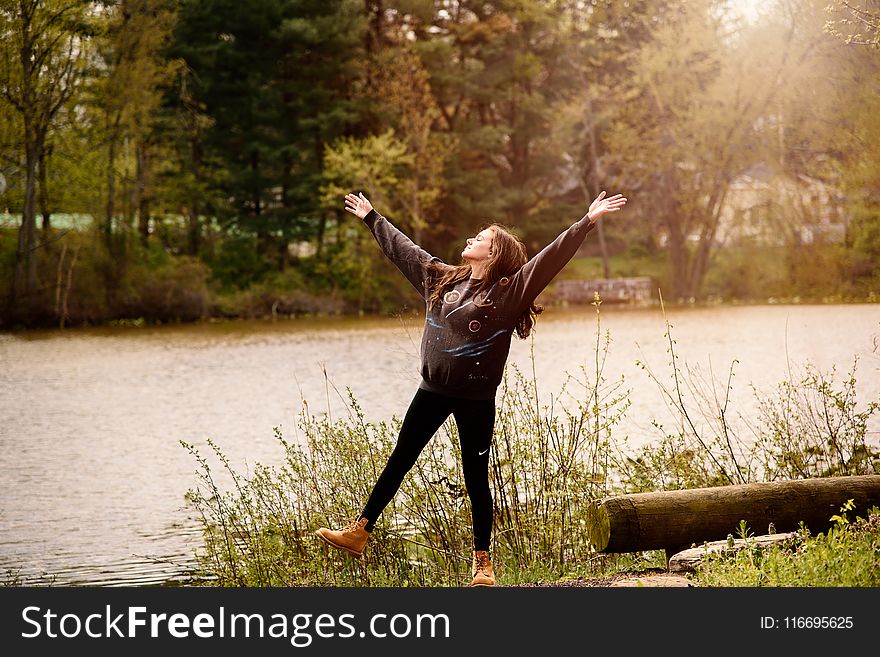 Photography Of A Woman Near Lake