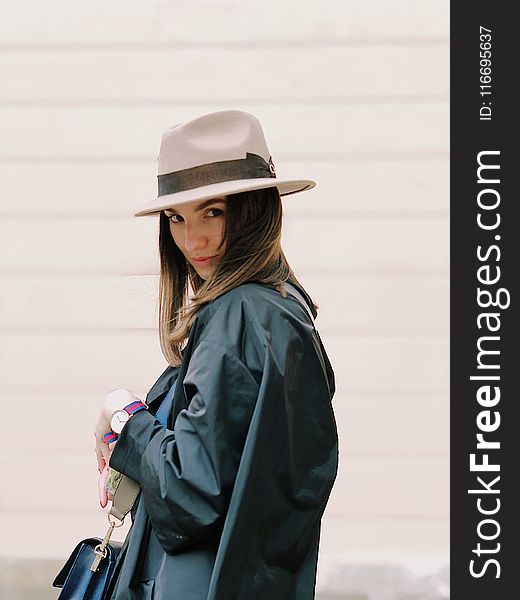 Photography of a Woman Wearing Fedora