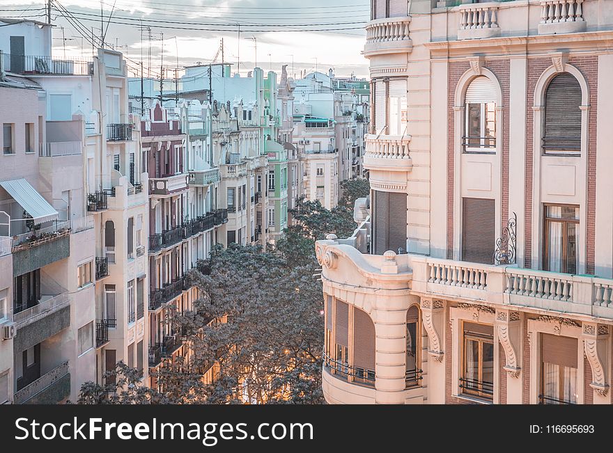 Beige And White Concrete Buildings Photography