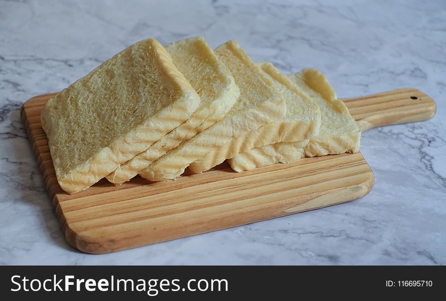 Photography of Sliced Bread on Chopping Board