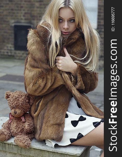 Photography of a Woman Wearing Fur Coat