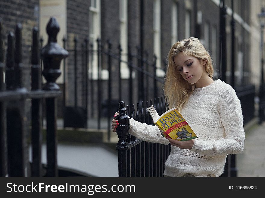 Woman Reading Boald Dahla Book