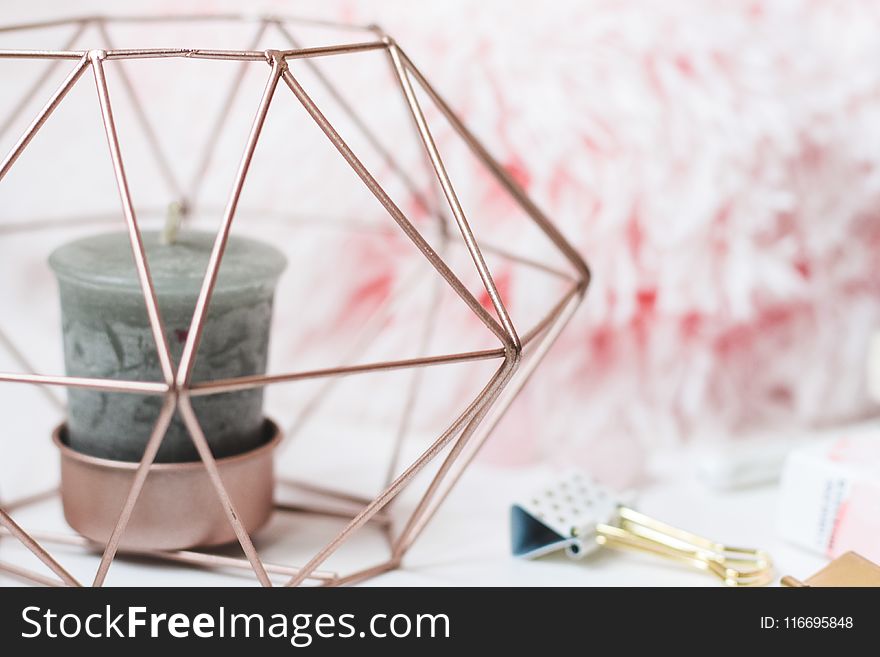 Selective Focus Photography Of Candle In Pink Ornate Holder