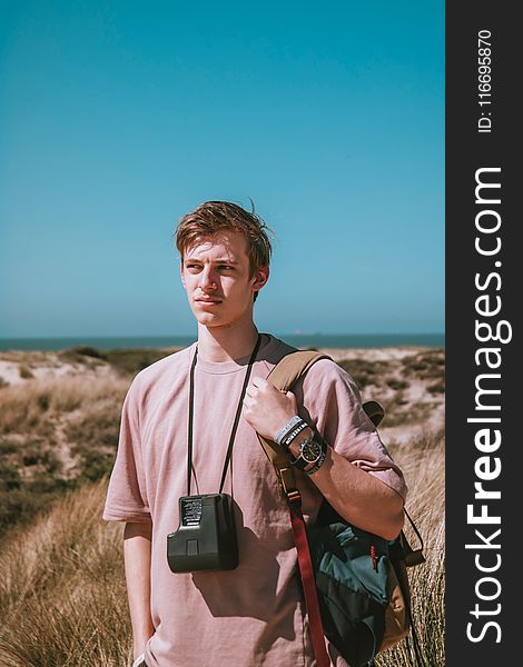 Photography of a Man Carrying Bag