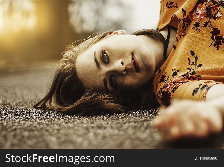 Woman Wearing Yellow Floral Top