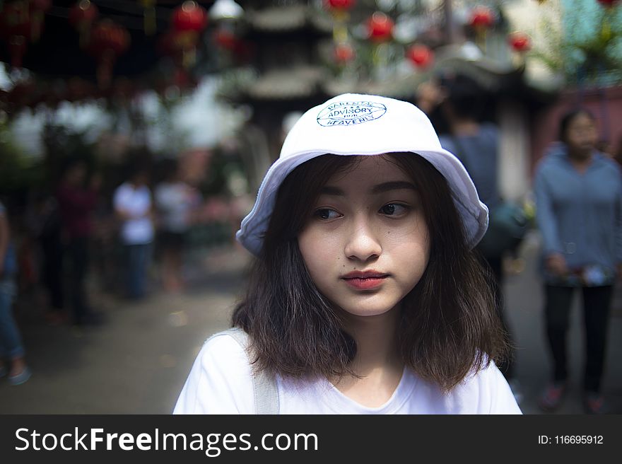 Woman Wearing White Bucket Cap