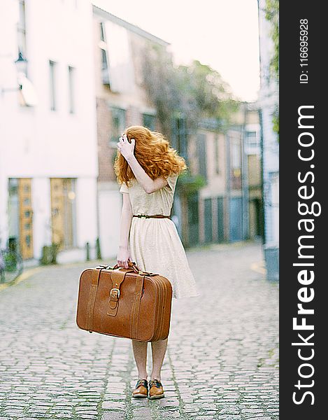 Woman In White Short-sleeved Dress Holding Brown Leather Suitcase