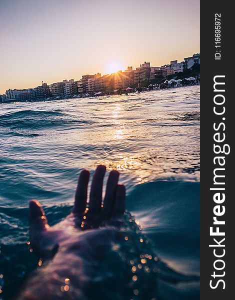 Person Soaking At The Beach