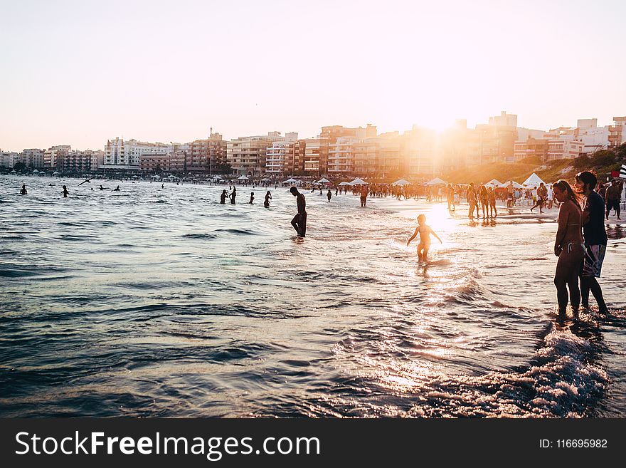 People At The Beach During Golden Hour