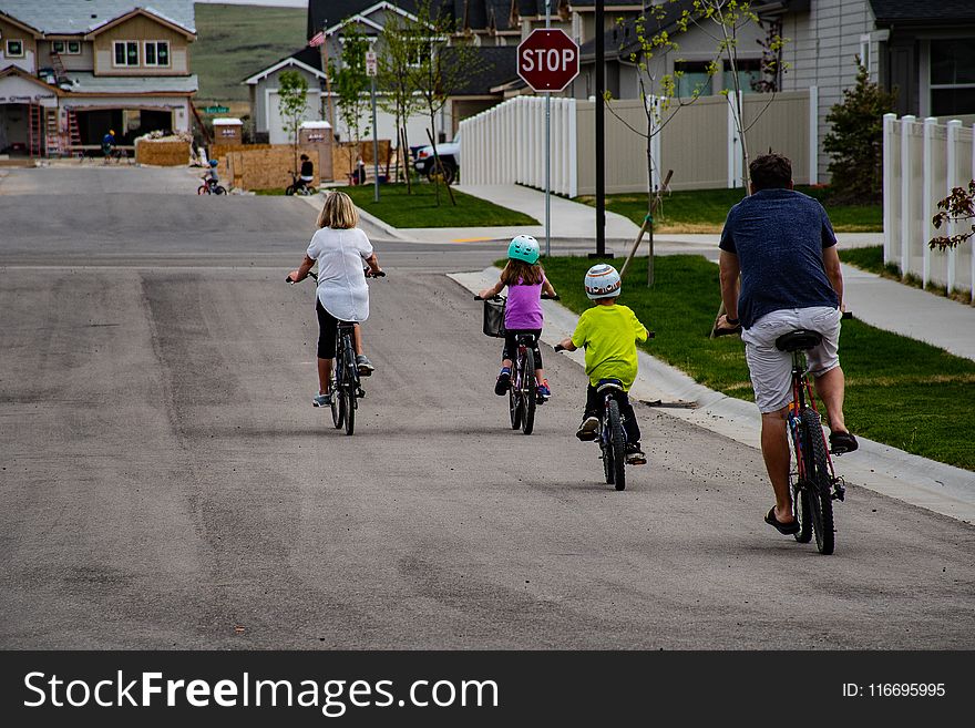 Family Riding On Bicycle