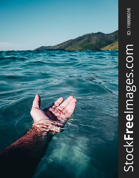 Person Soaking On Body Of Water