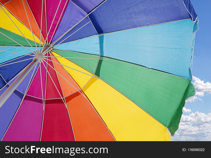 Multicolored Outdoor Umbrella Under Cloudy Sky