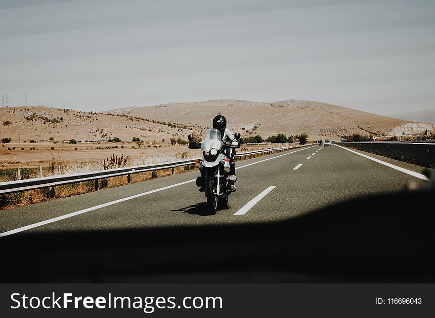 Person Riding Motorcycle