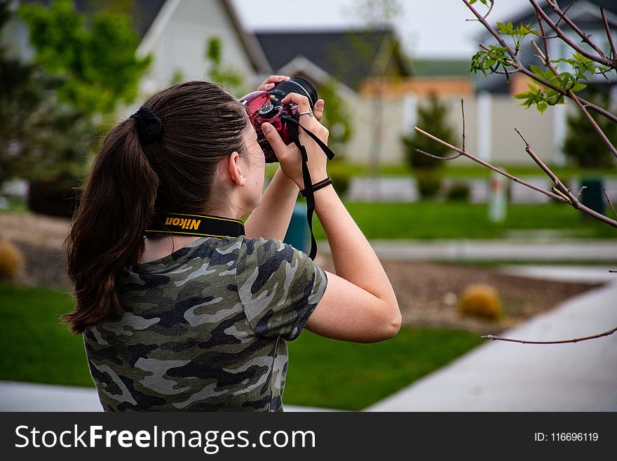 Woman Wearing Camouflage Scoop-neck Shirt