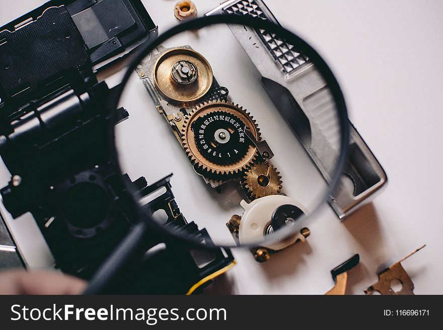 Shallow Focus Photography Of Magnifying Glass With Black Frame