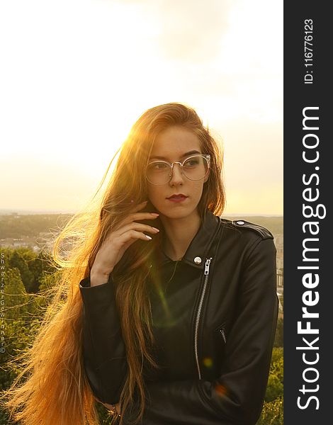 Woman Wearing Black Leather Bikers Jacket and Sunglasses