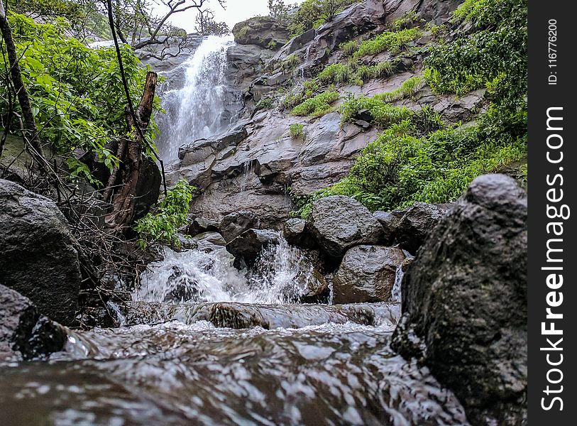 Timelapse Photography of Waterfalls Under Cumulus Nimbus Clouds