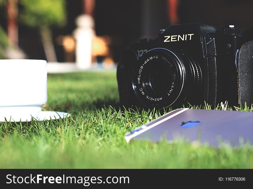 Black Zenit Dslr Camera in Shallow Focus Photography