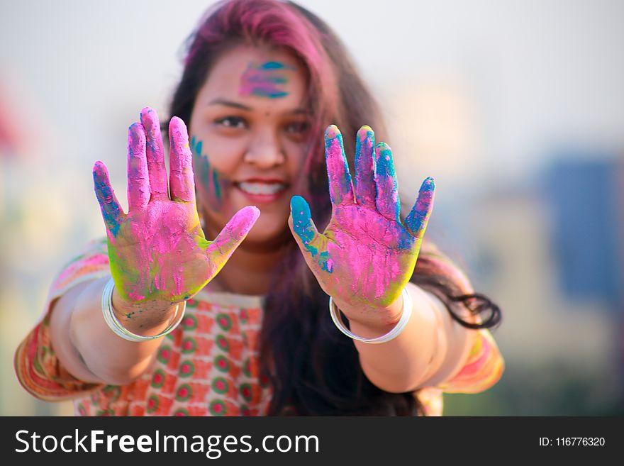 Woman Showing Her Hands With Assorted Color Paints