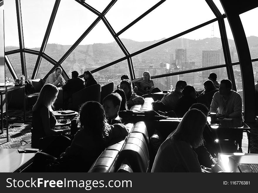 Grayscale Photo Of People At Restaurant