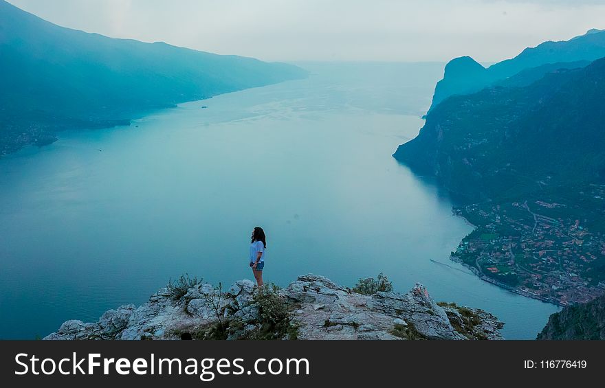 Woman Standing on Mountain during Dayttime