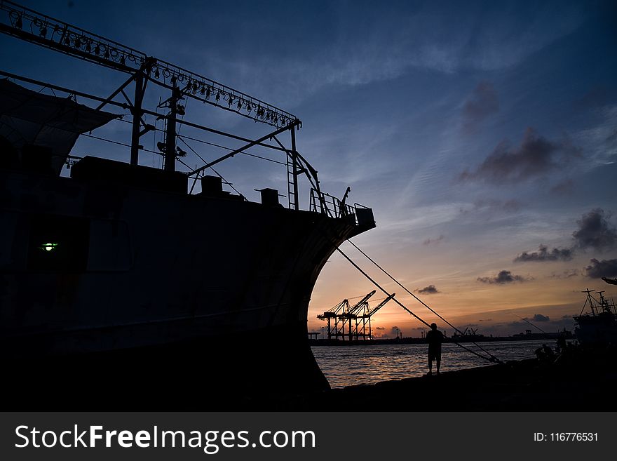Silhouette Of Ship Docked