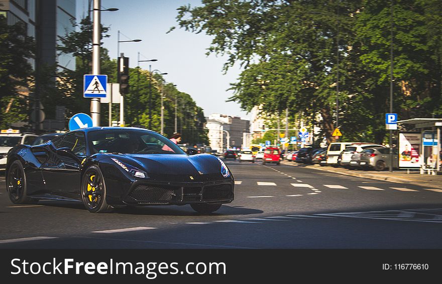 Photography Of Black Ferrari On Roadway