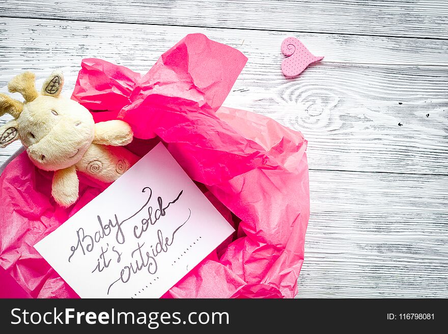 Birth of girl - baby shower concept on wooden background top view