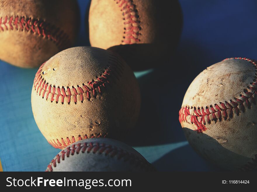 Old rugged baseballs in group close up