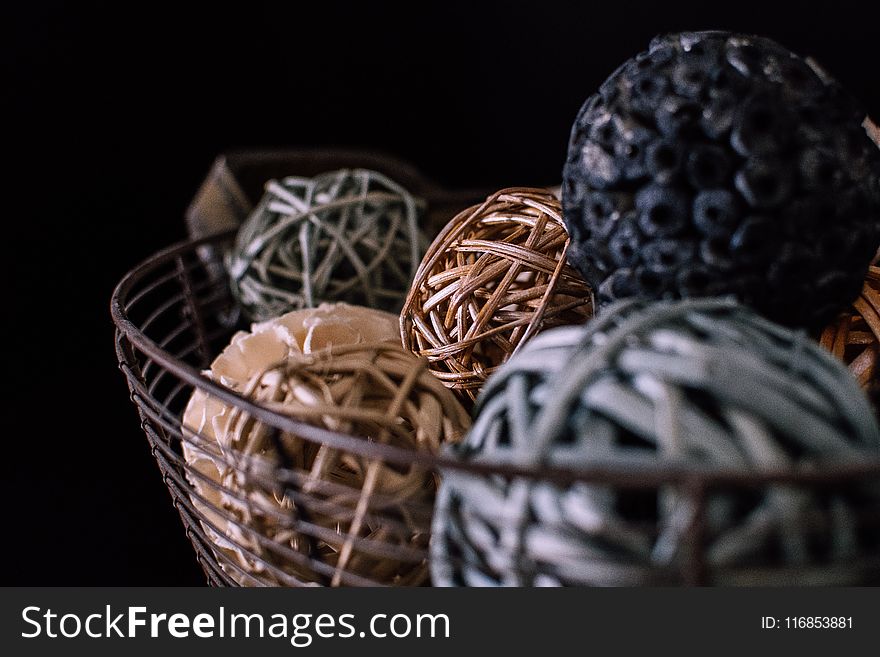 Brown And Gray Vine Balls On Brown Metal Rack