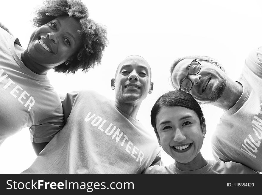 Grayscale Photography of Group of People Wearing Volunteer-printed Shirt