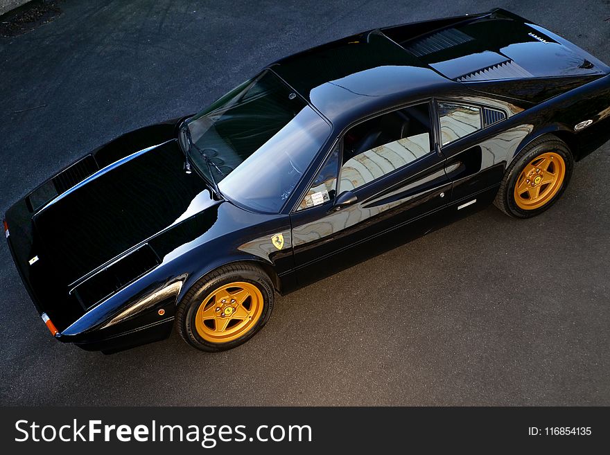 Black Coupe On Gray Surface