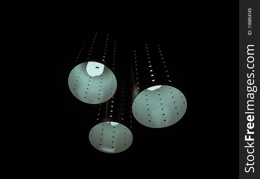 Photography of Three Lamps on Dark Room