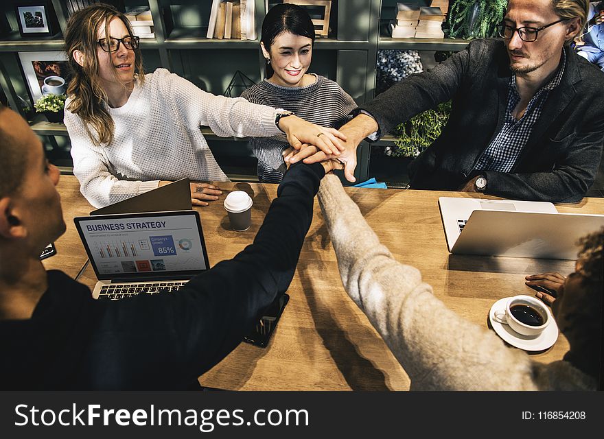 Group of People Holding Hands Forming Teamwork