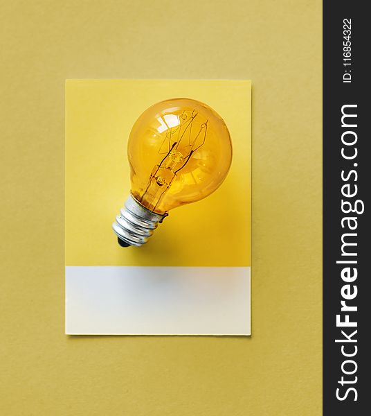 Brown Light Bulb Photo on Yellow Surface