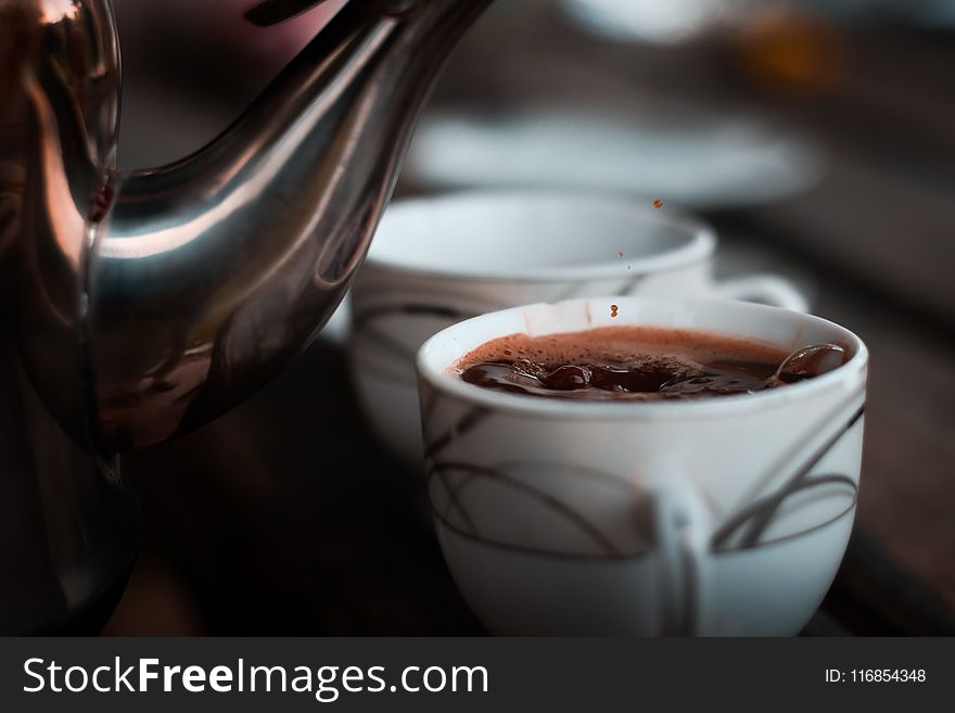 Selective Focus Photography of Teacup With Coffee