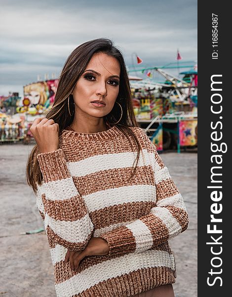 Woman Wearing Knitted White And Brown Stripe Sweater