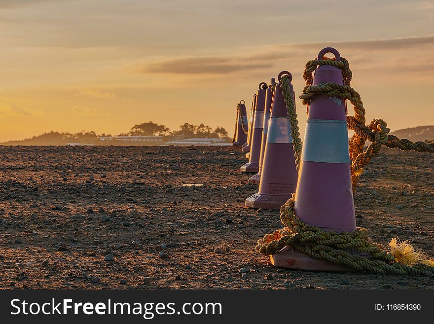 Photo of Traffic Cones with Ropes During Dusk