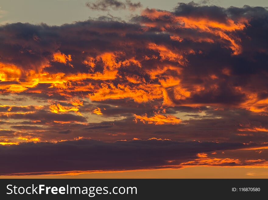Dramatic clouds in a sunset light
