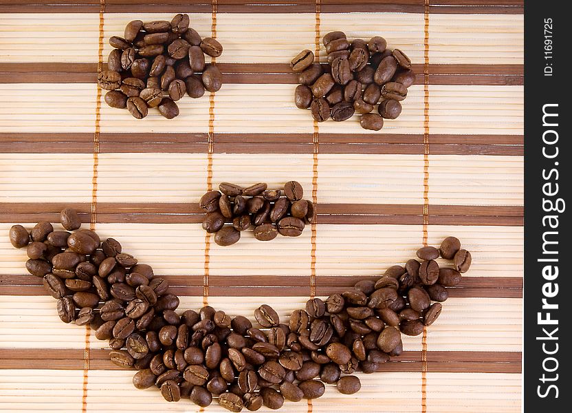 Smile With Coffee Beans On A Mat