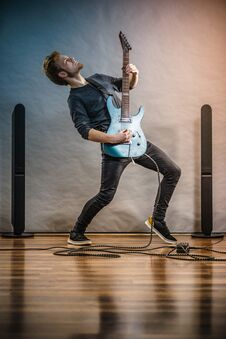 Young Man Playing Electric Guitar Stock Photos