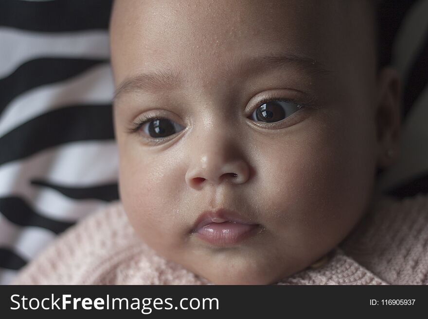 Close up portrait of a 4 month old baby girl face. Close up portrait of a 4 month old baby girl face