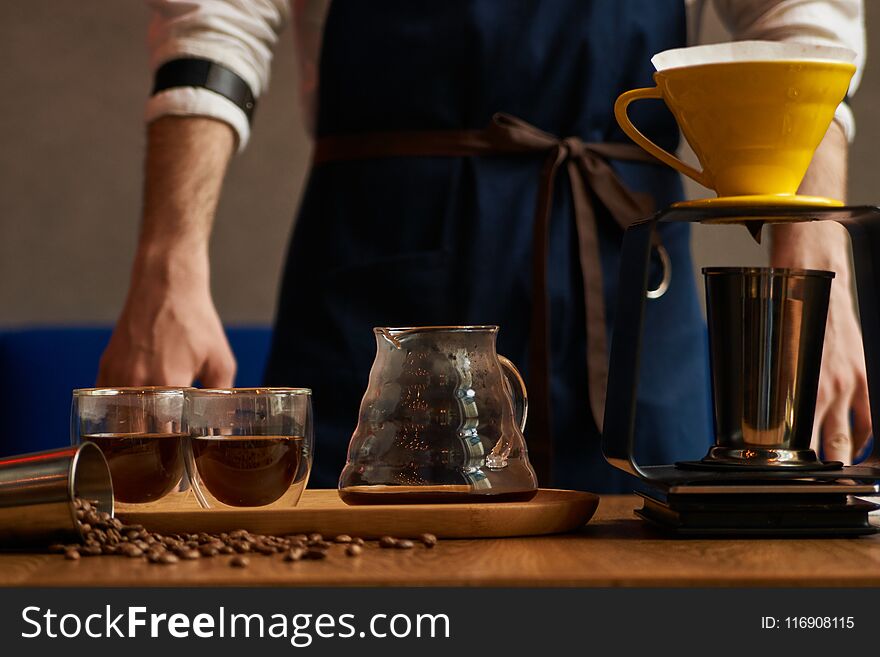 Professional Barista or coffee barman prepares coffee