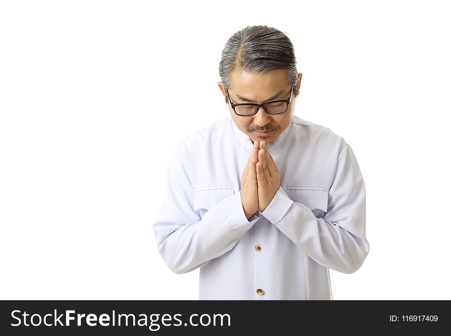 The Asian man standing on the white background with Thai classic dressed.