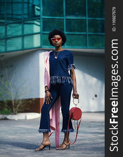 Shallow Focus Photography Of Woman In Blue Shirt