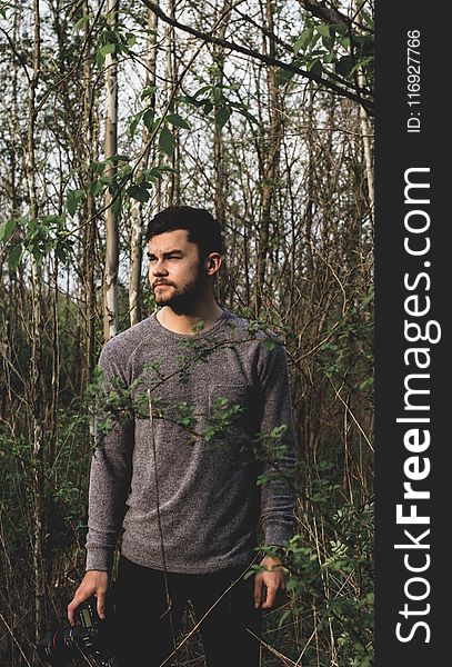 Landscape Photo of Man Standing on Forest and Wearing Crew-neck Sweatshirt
