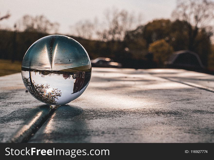 Shallow Focus Photography of Clear Glass Ball