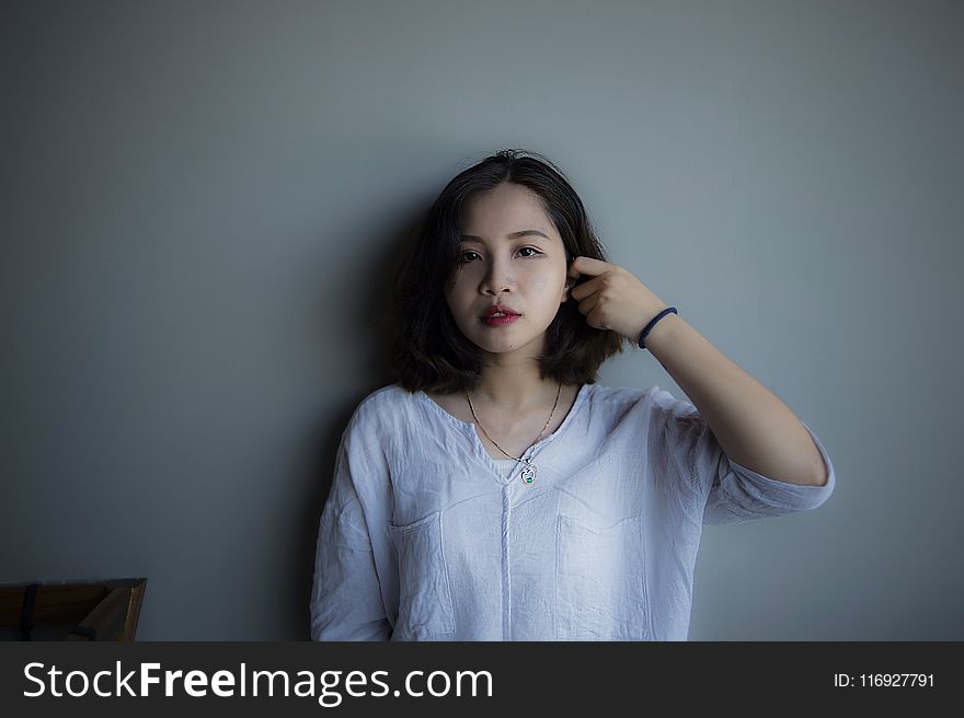 Woman Wearing Blue Long-sleeved Shirt