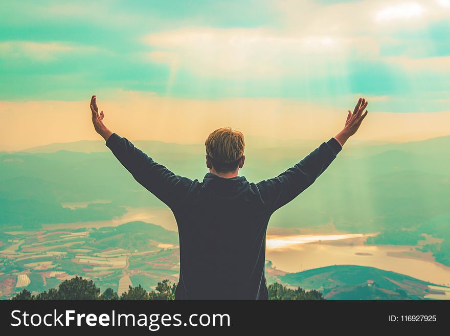 Man Standing On Mountain